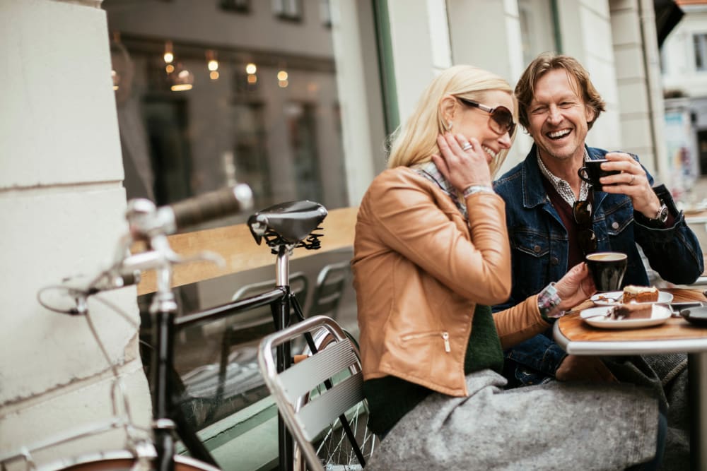 Couple enjoying morning coffee and conversation at their favorite café near Ellington Midtown in Atlanta, Georgia