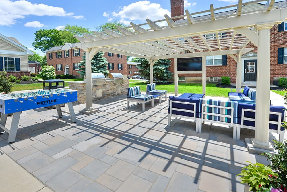 Sunny outdoor lounge area at The Villas at Bryn Mawr Apartment Homes in Bryn Mawr, Pennsylvania