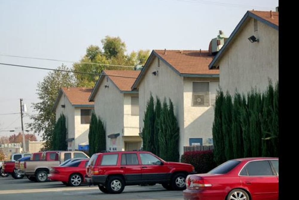 Parking spaces and housing at El Potrero Apartments in Bakersfield, California