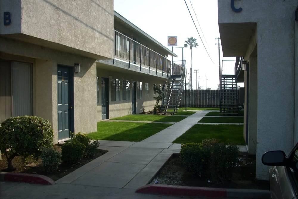 Outdoor paths at El Potrero Apartments in Bakersfield, California