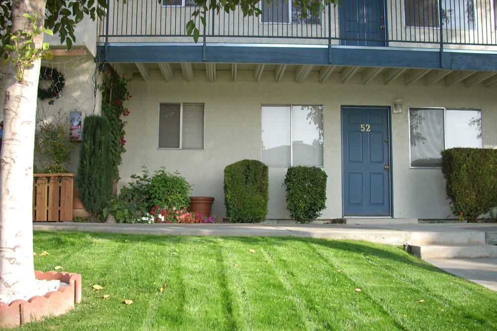 Beautiful outdoor landscaping at El Potrero Apartments in Bakersfield, California