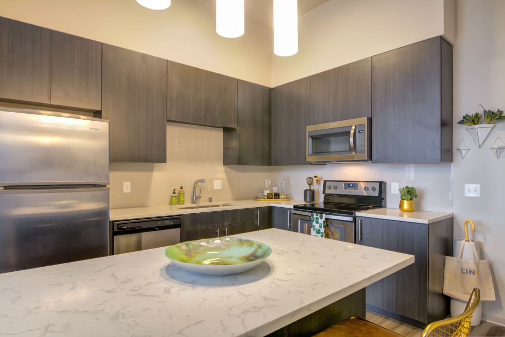 Kitchen with granite counters at The Link Minneapolis in Minneapolis, Minnesota