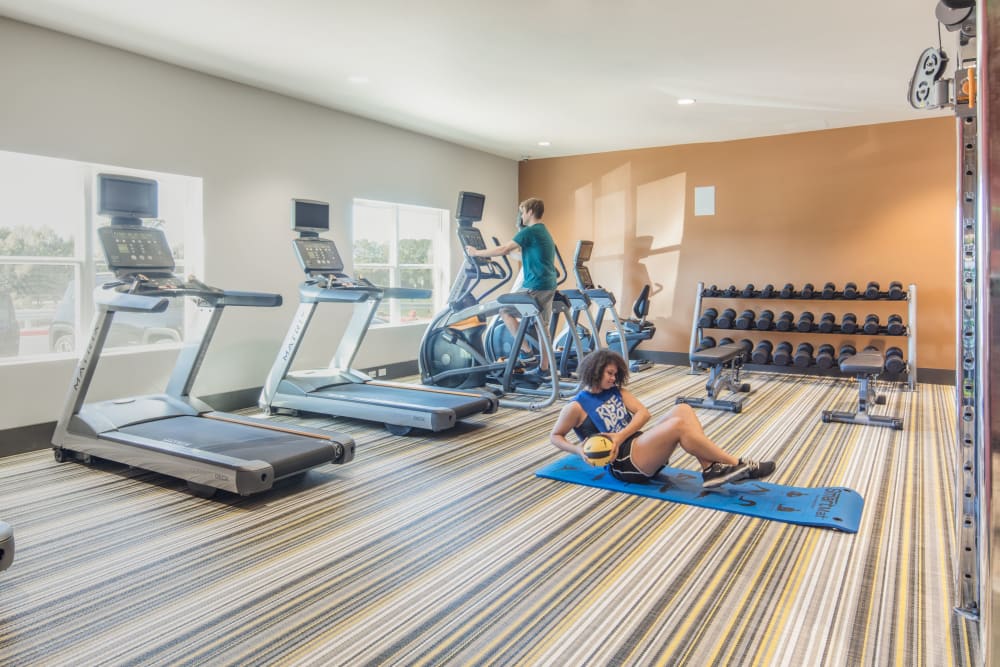 Fitness center with treadmills at evolve Tuscaloosa in Tuscaloosa, Alabama
