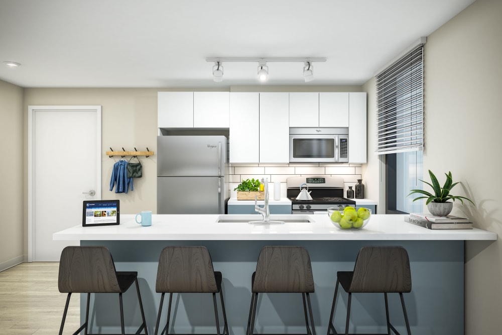 Fully equipped kitchen with stainless steel appliances at HERE State College in State College, Pennsylvania