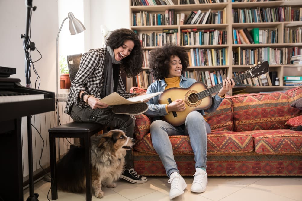 Residents playing music for their dog at evolve on Main in Pullman, Washington
