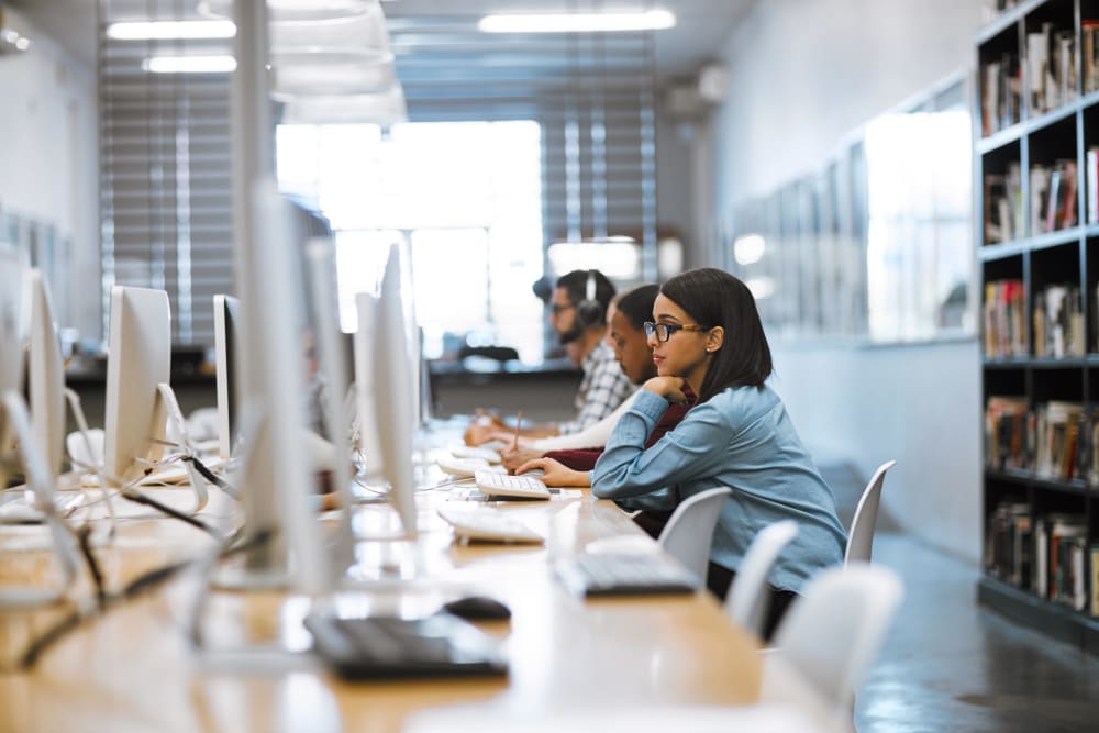 Resident working on a project in a computer lab near HERE State College in State College, Pennsylvania