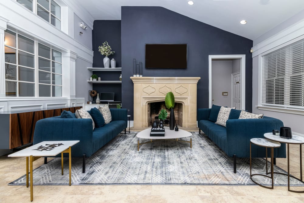 House interior with blue velvet couches and coffee table at The Lyndon in Irving, Texas