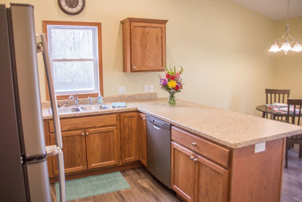 Kitchen and dining room in the townhomes at Arlington Place Oelwein in Oelwein, Iowa