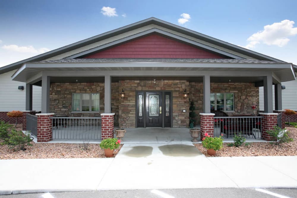 Side entrance to the community with a large covered patio at Traditions of Owatonna in Owatonna, Minnesota