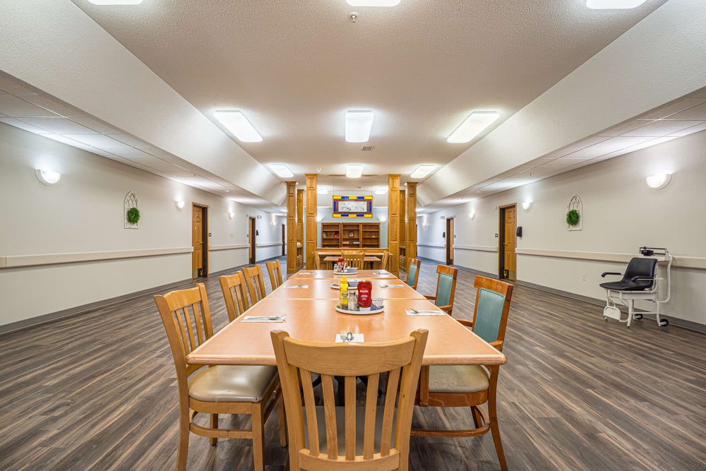 Large lunch room with a single central table at Traditions of Owatonna in Owatonna, Minnesota