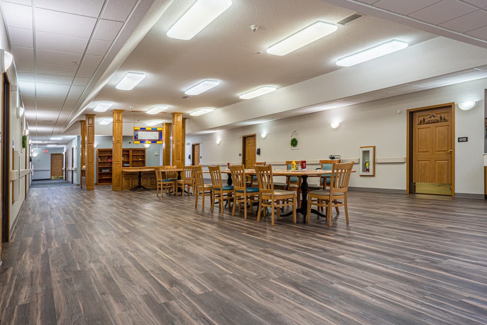 Large dining room connected to resident apartments at Traditions of Owatonna in Owatonna, Minnesota