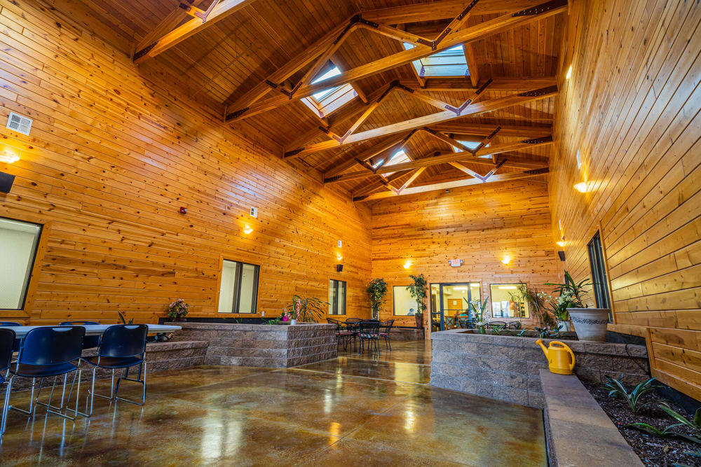 Wood room with stone flooring and beautiful decor at Traditions of Owatonna in Owatonna, Minnesota