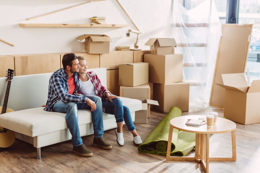 Couple takes a break from packing near Storage Units in Panama City Beach, Florida