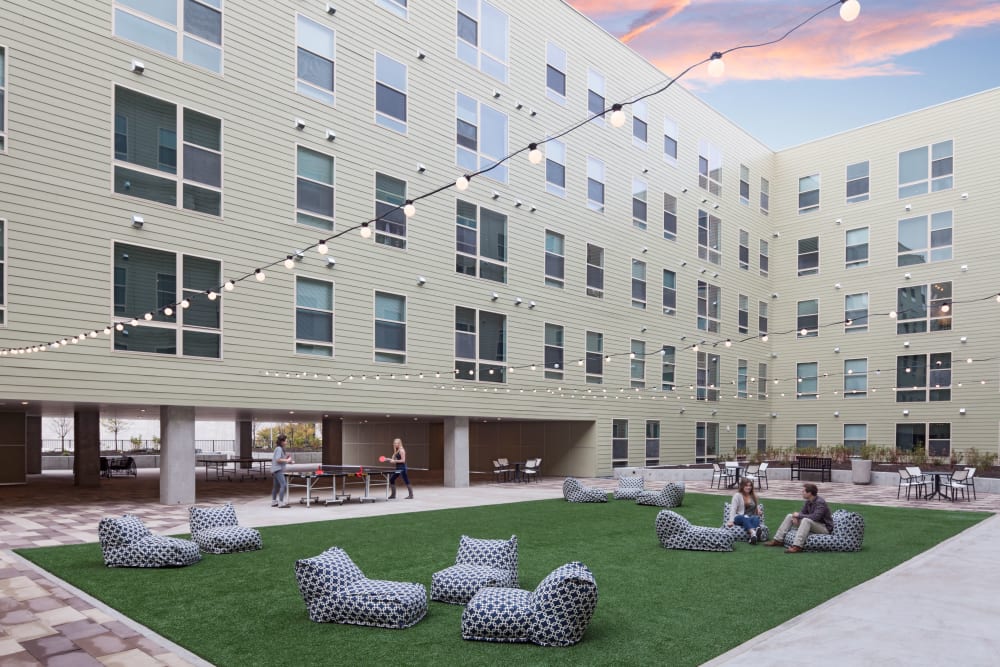 Courtyard with games like cornhole at LATITUDE in Lincoln, Nebraska