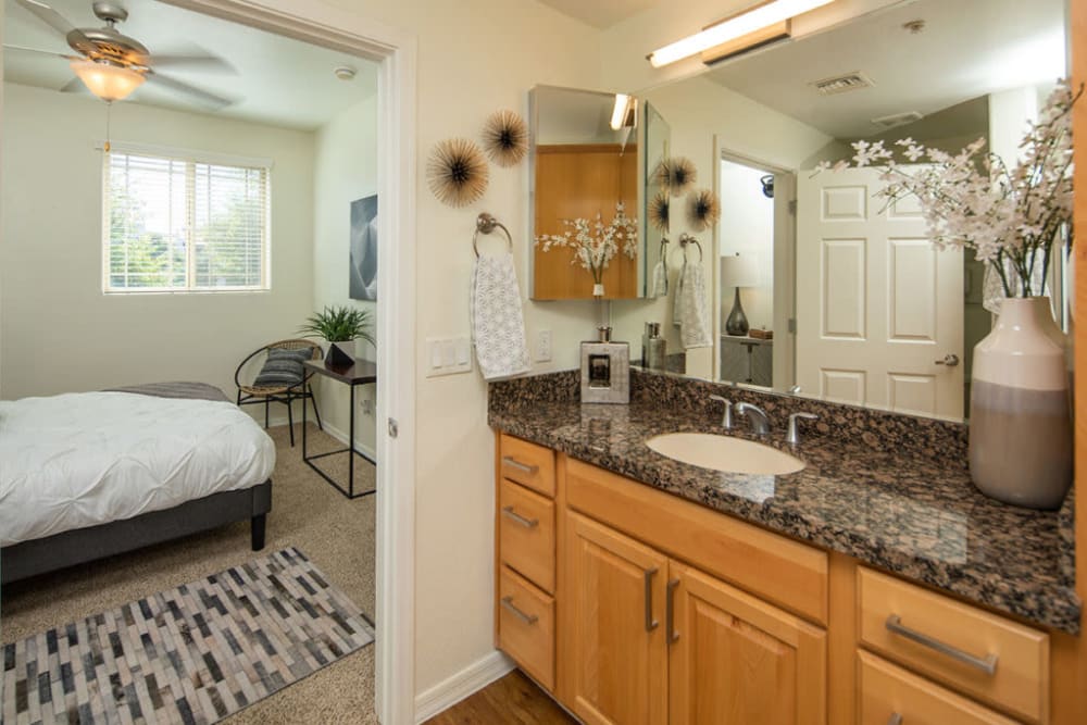 Bedroom and bathroom at The Fleetwood in Tempe, Arizona