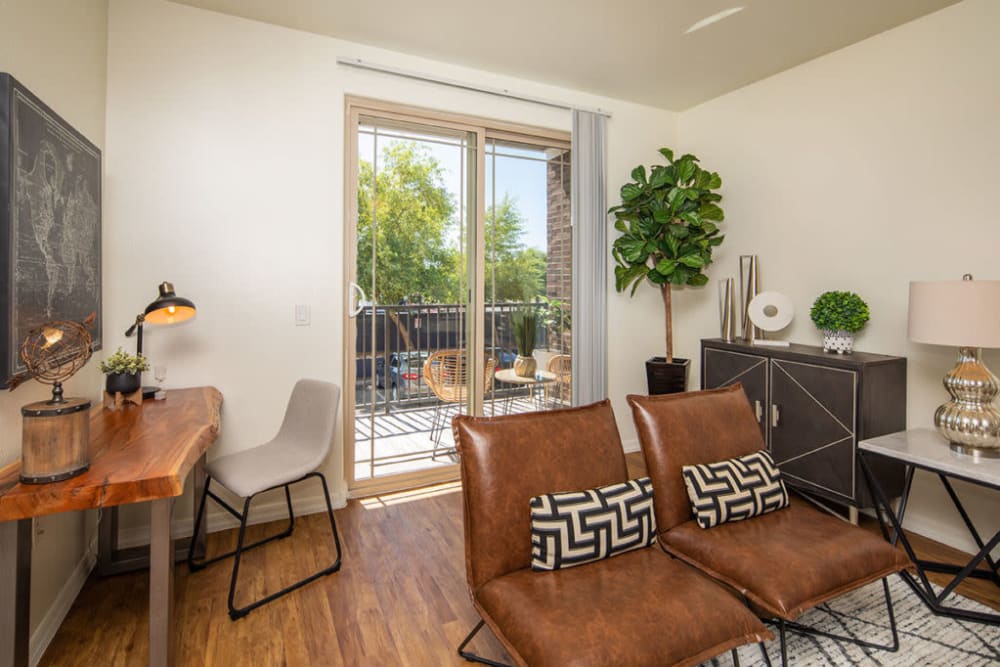 Living area with leather chairs at The Fleetwood in Tempe, Arizona