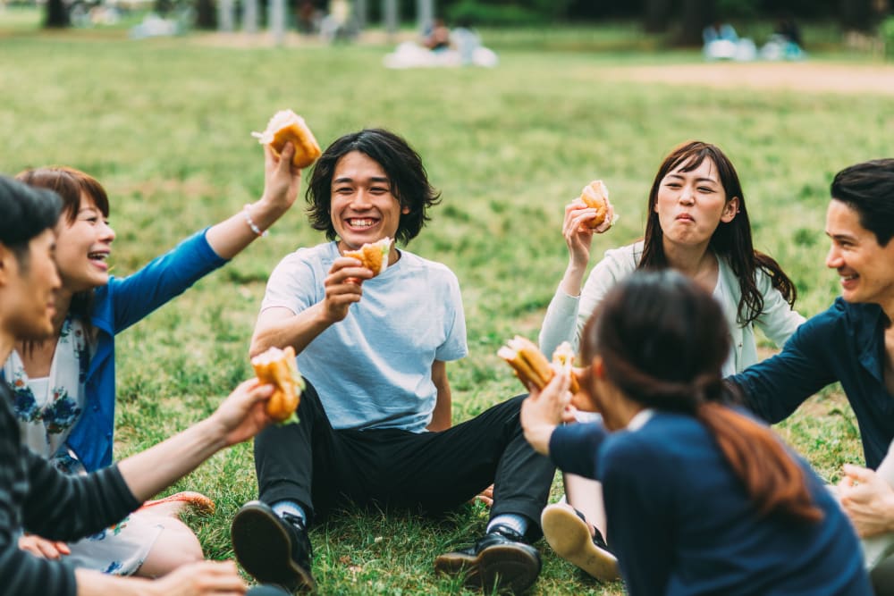 Friends having a picnic together at IDENTITY Miami in Miami, Florida