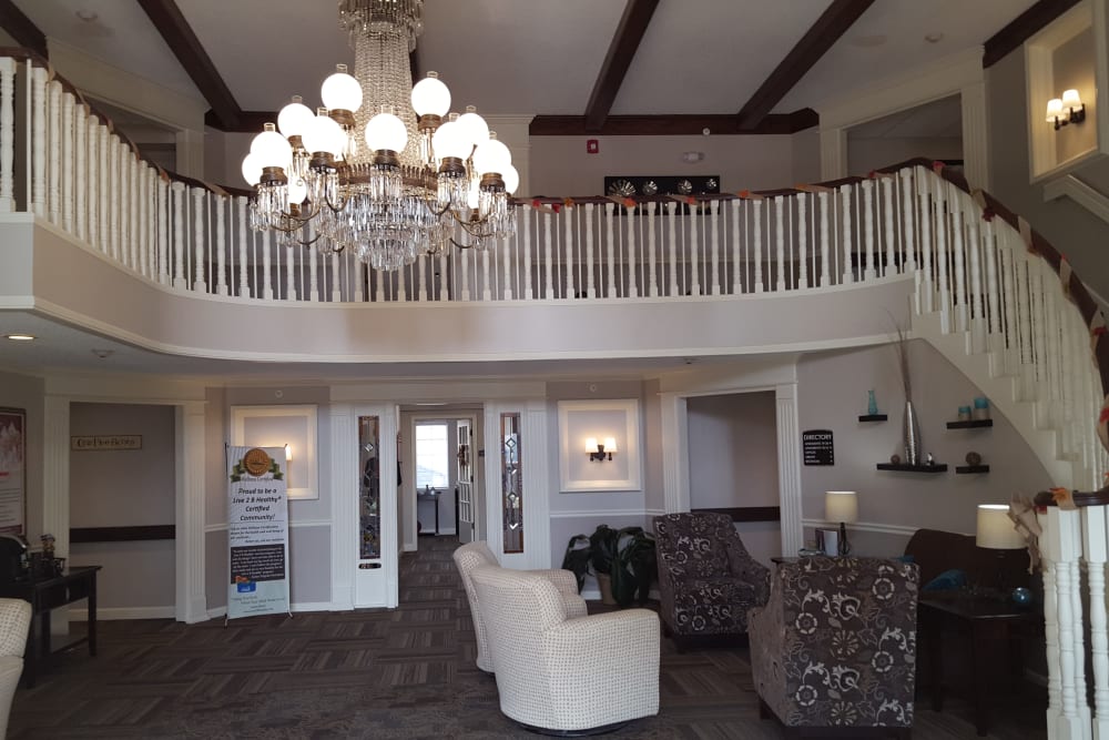 Main lobby area with stairs leading to the second floor at Brown Deer Place in Coralville, Iowa