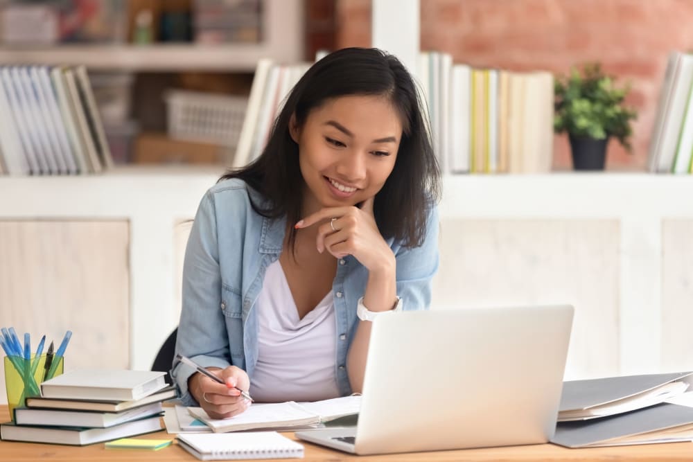 Resident working on her laptop at The Link University City in Philadelphia, Pennsylvania