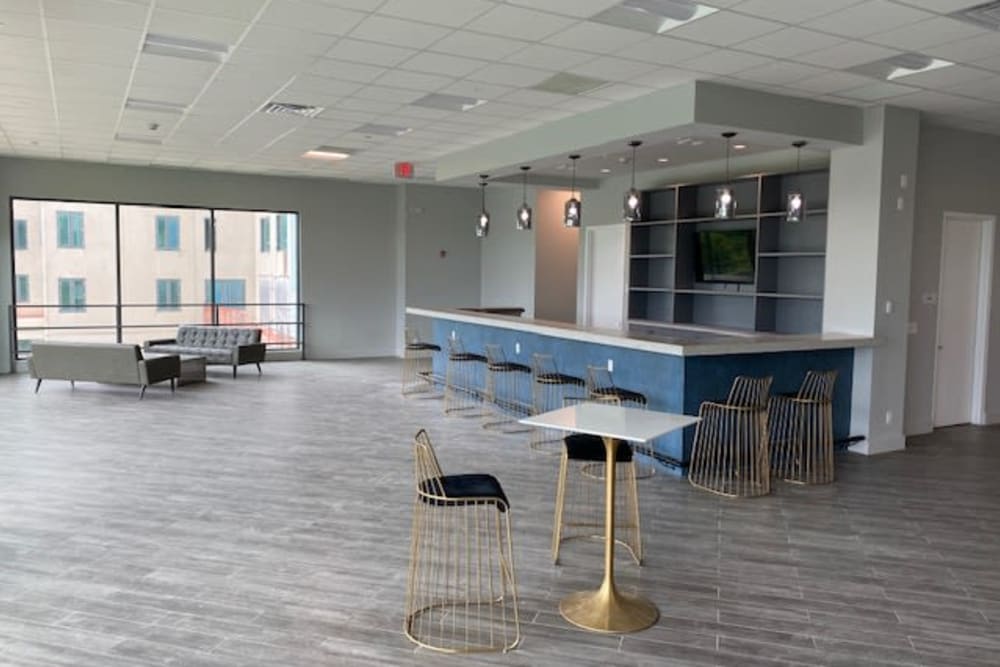 Open clubhouse with blue bar at Monarch at Ridge Hill in Yonkers, New York
