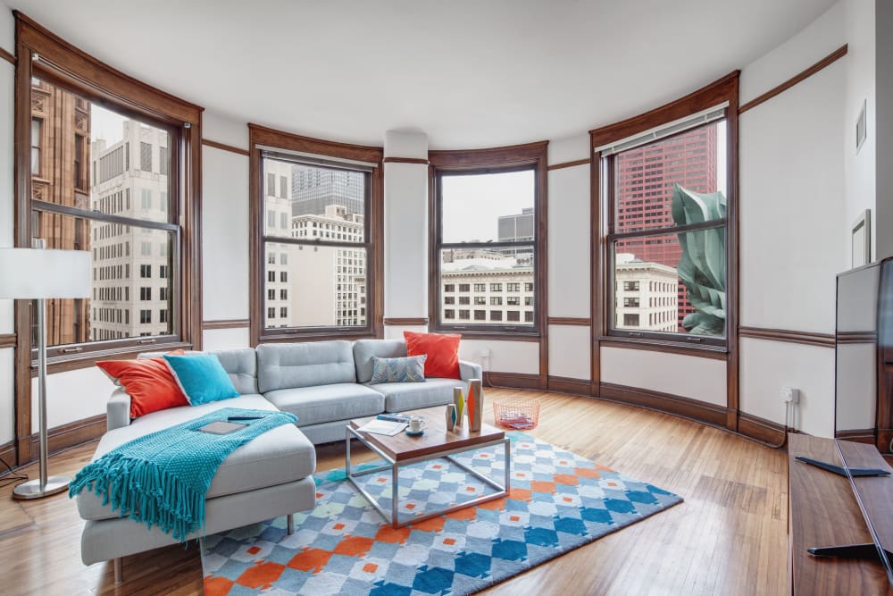 Living room with wood style flooring at Arc at Old Colony in Chicago, Illinois