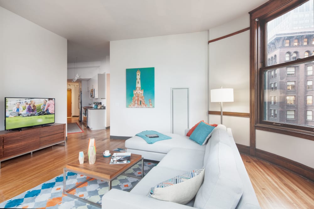 Bright, spacious living room at Arc at Old Colony in Chicago, Illinois