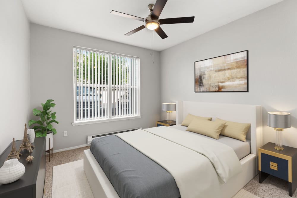 A comfortable bedroom at Wildreed Apartments in Everett, Washington