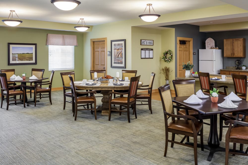 Dining room with lots of spaced out tables at Edencrest at Siena Hills in Ankeny, Iowa