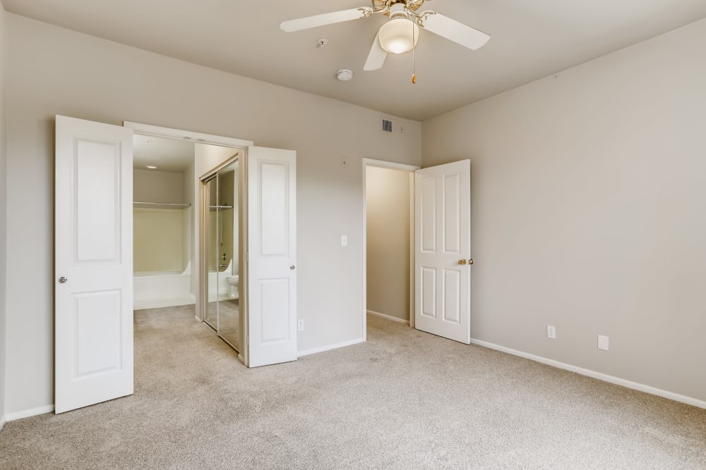 Spacious bedroom with a walk-in closet at Alicante Apartment Homes in Aliso Viejo, California
