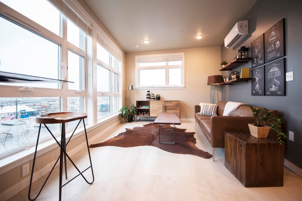 Large bay windows providing an incredible city view from a model home's living space at Brooklyn Yard in Portland, Oregon