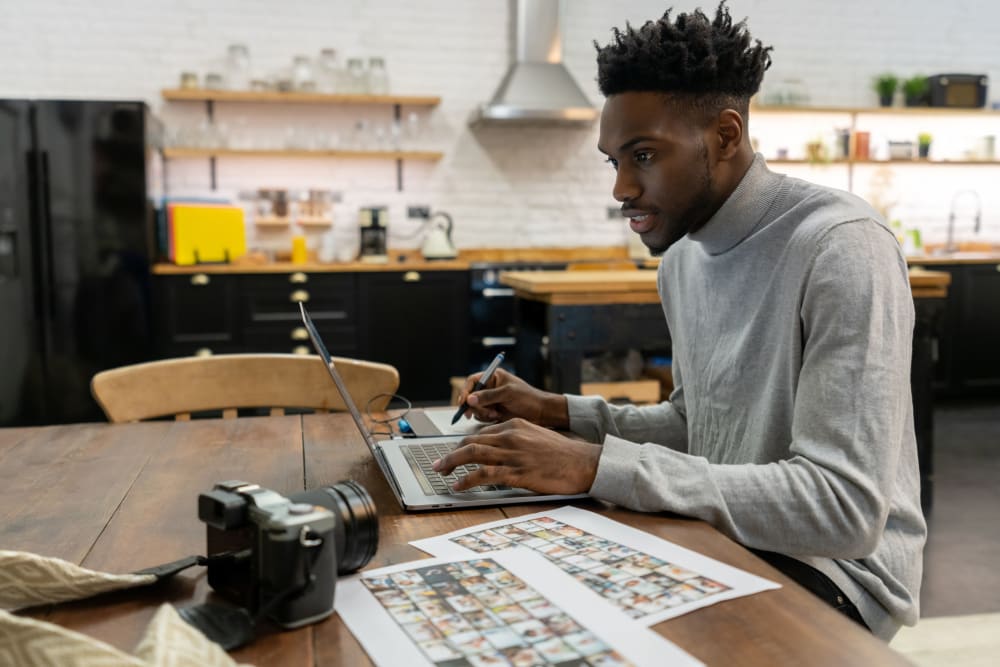 Resident working on his laptop at The Link University City in Philadelphia, Pennsylvania