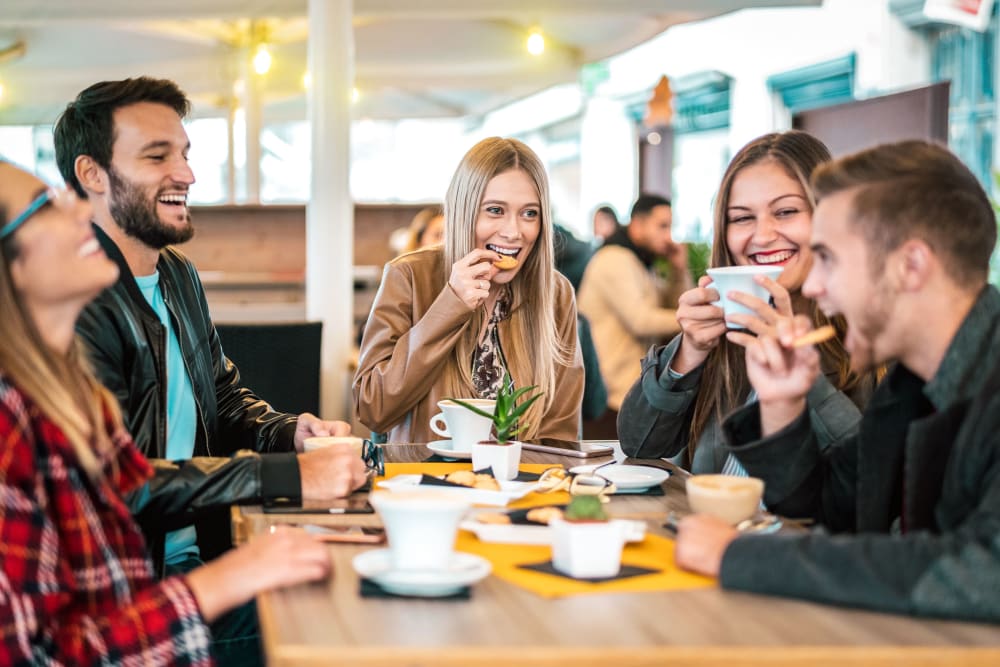 Friends having lunch together near The Link University City in Philadelphia, Pennsylvania