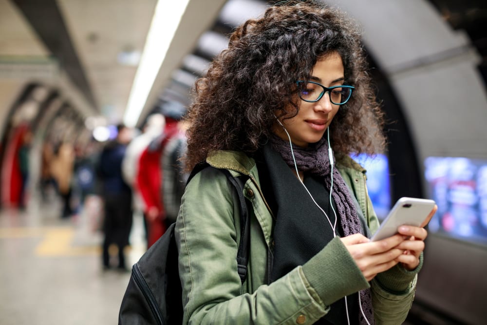 Resident waiting for the train at The Link University City in Philadelphia, Pennsylvania