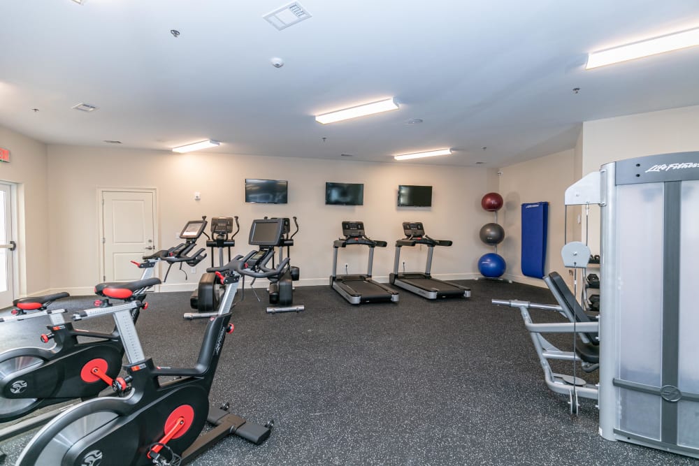 Well-equipped onsite fitness center at The Station at River Crossing in Macon, Georgia