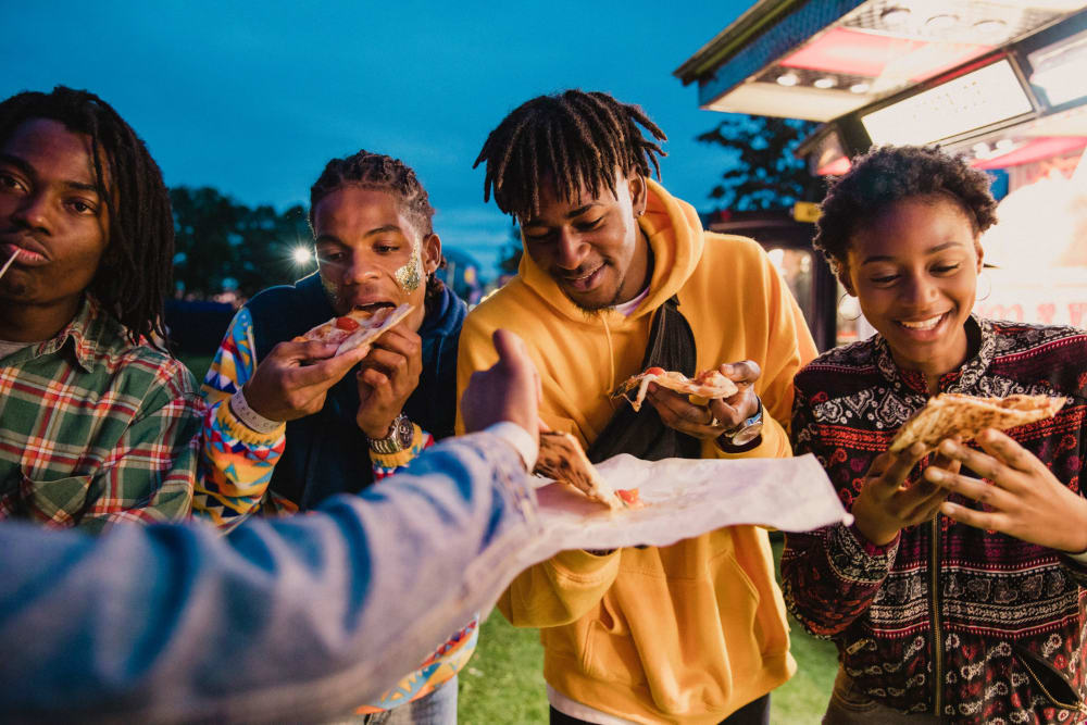 Friends enjoying food together near Georgia Tech at HERE Atlanta in Atlanta, Georgia