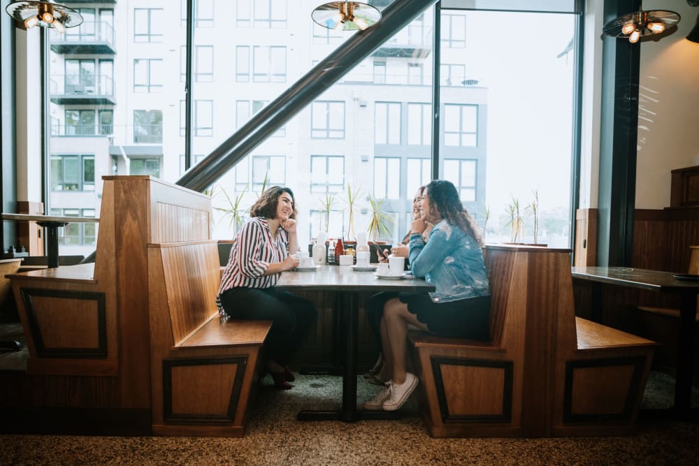 Residents chatting at a local cafe in Miami, Florida near The Cloisters