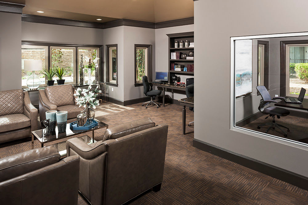 Business center with comfortable seating outside the meeting room at Hyde Park at Montfort in Dallas, Texas