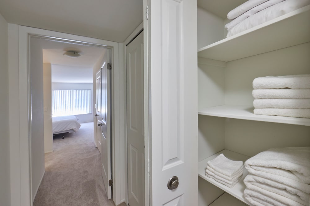 Closet full of linens in model hallway at Aldingbrooke in West Bloomfield, Michigan