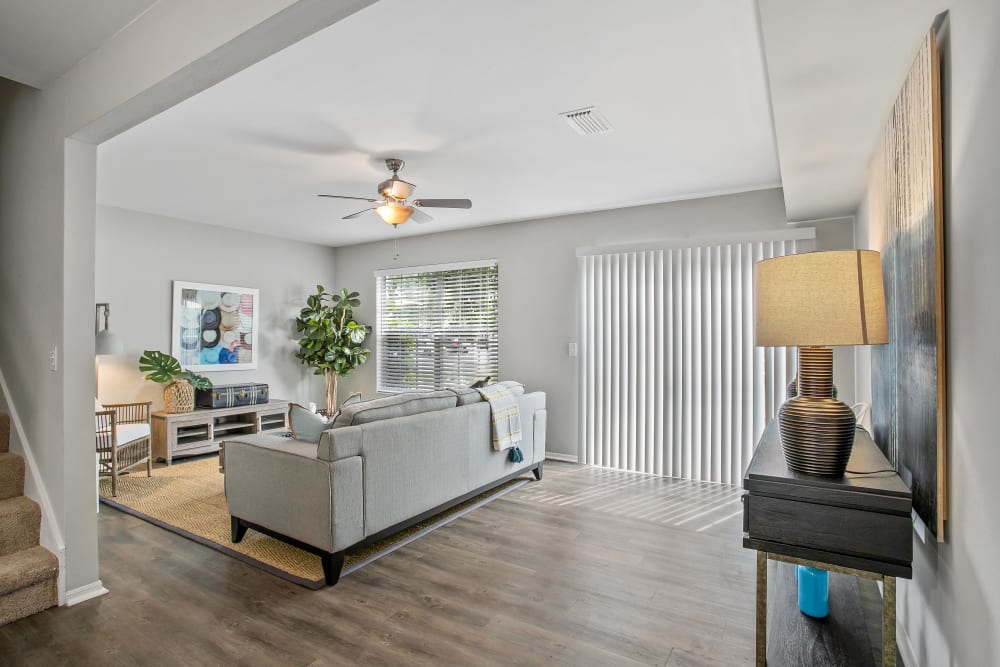 Ceiling fan and hardwood flooring throughout the living space of a model home at The Coast of Naples Florida in Naples, Florida
