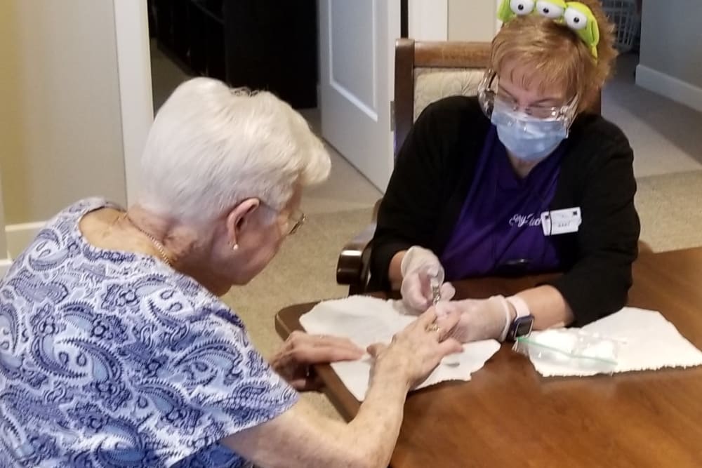 Staff helping resident at Emery Place in Robins, Iowa