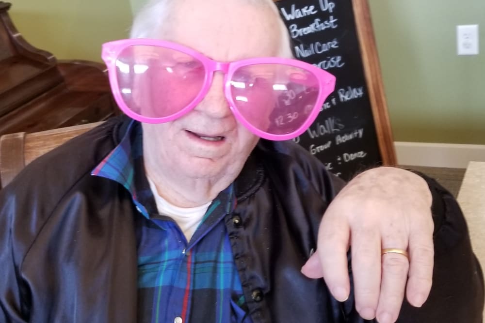 Resident with costume glasses at Emery Place in Robins, Iowa