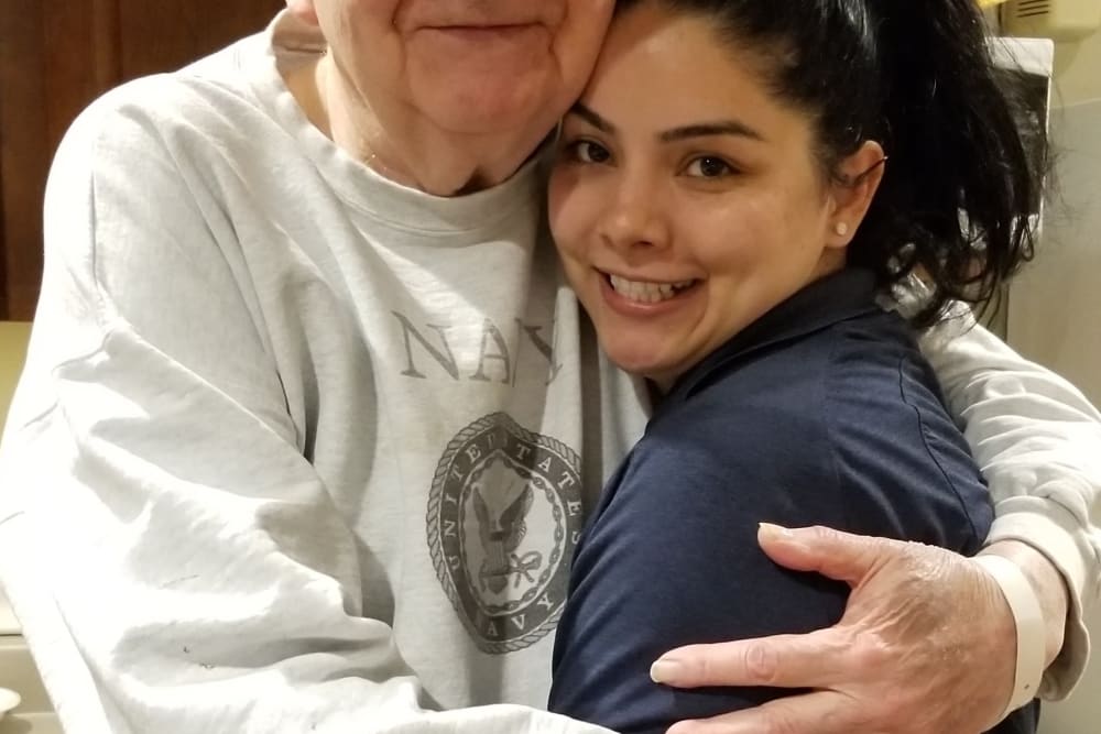 Resident hugging their granddaughter at Emery Place in Robins, Iowa