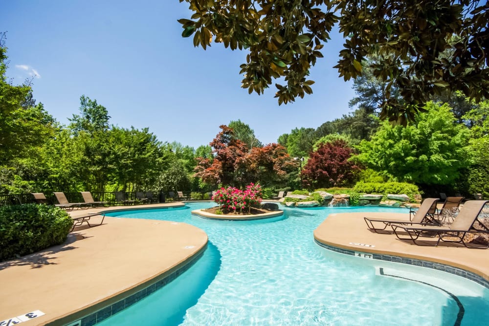 Resort-style swimming pool surrounded by lush flora at Park at Vinings in Smyrna, Georgia