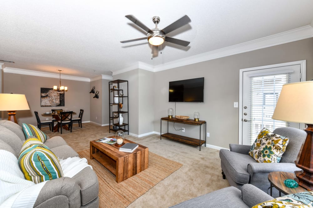 Ceiling fan in the well-furnished living area of a model home at 860 South in Stockbridge, Georgia
