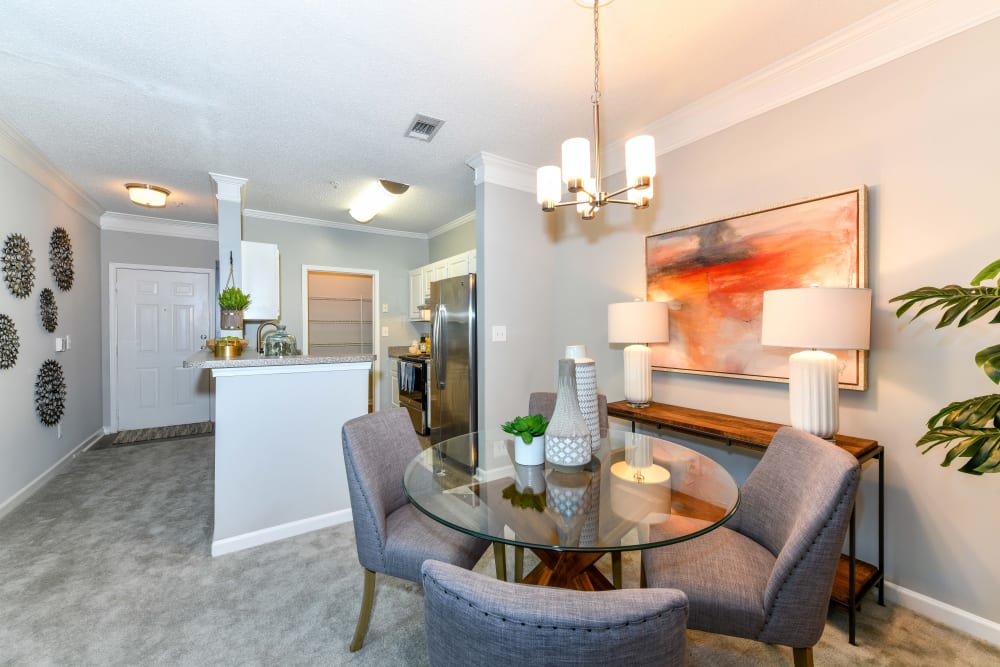 Well-furnished dining area in an open-concept model home at 860 South in Stockbridge, Georgia