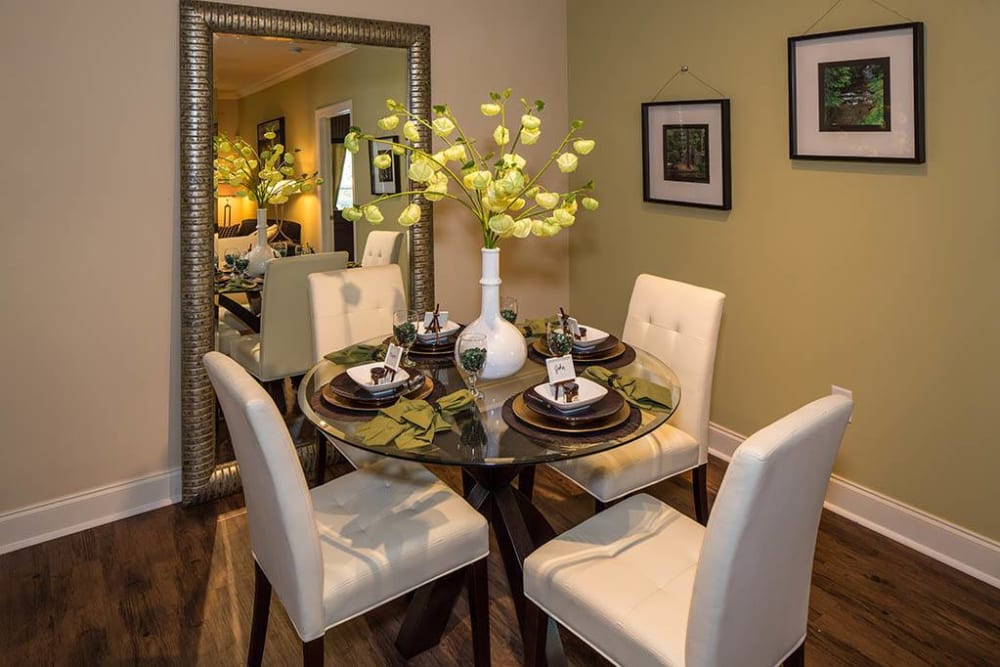 Dining area with an accent wall in a model apartment at The Preserve at Greison Trail in Newnan, Georgia