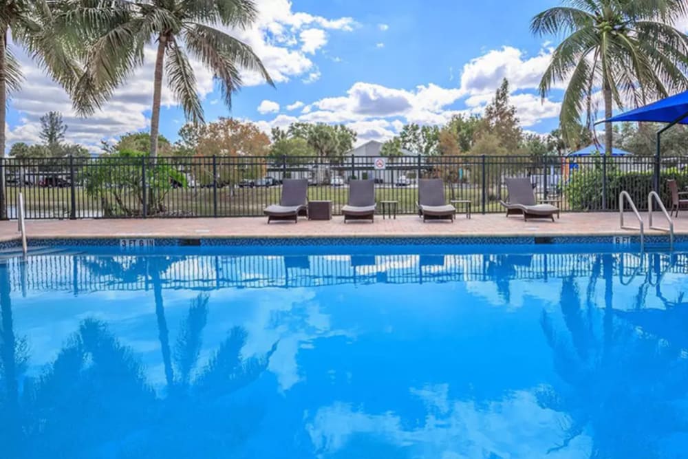 Inviting swimming pool on a beautiful day at The Coast of Naples Florida in Naples, Florida