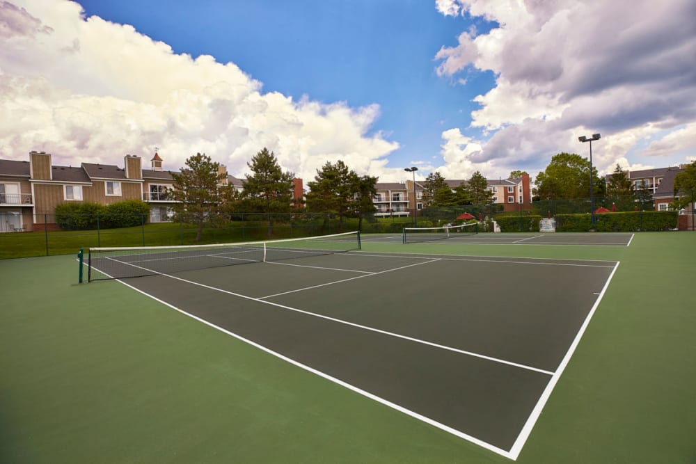 Illuminated tennis courts at Citation Club in Farmington Hills, Michigan