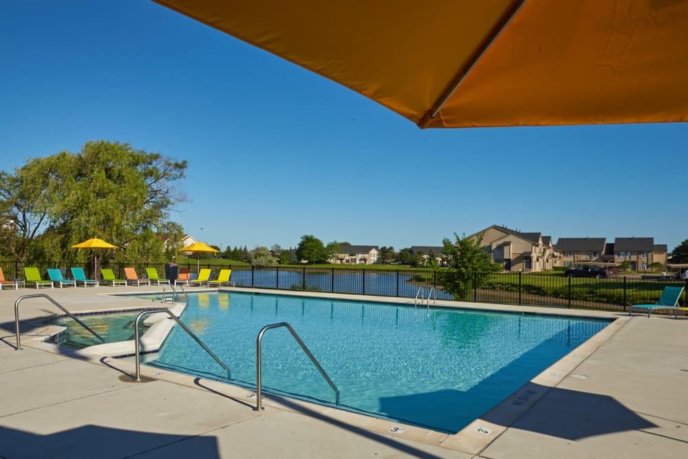 Swimming pool with views of the lake at Lakeside Terraces in Sterling Heights, Michigan