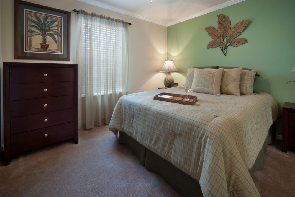 Bedroom with green wall at Keys Lake Villas in Key Largo, Florida